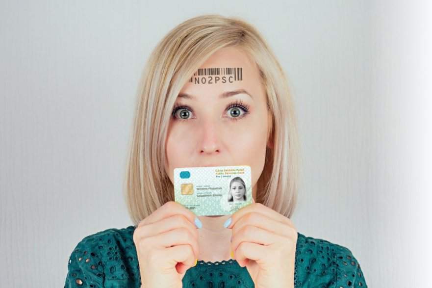 Woman holding PSC card